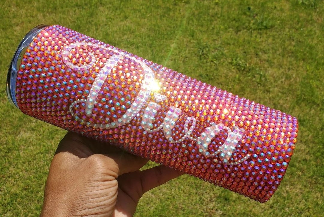 Red rhinestone tumbler, skinny tumbler, new tumbler.20oz stainless steel double wall insulated tumbler. Straws and lids are included with all tumblers When ordering, please remember to to include the colors you would like the name made in and also double check your spelling.
