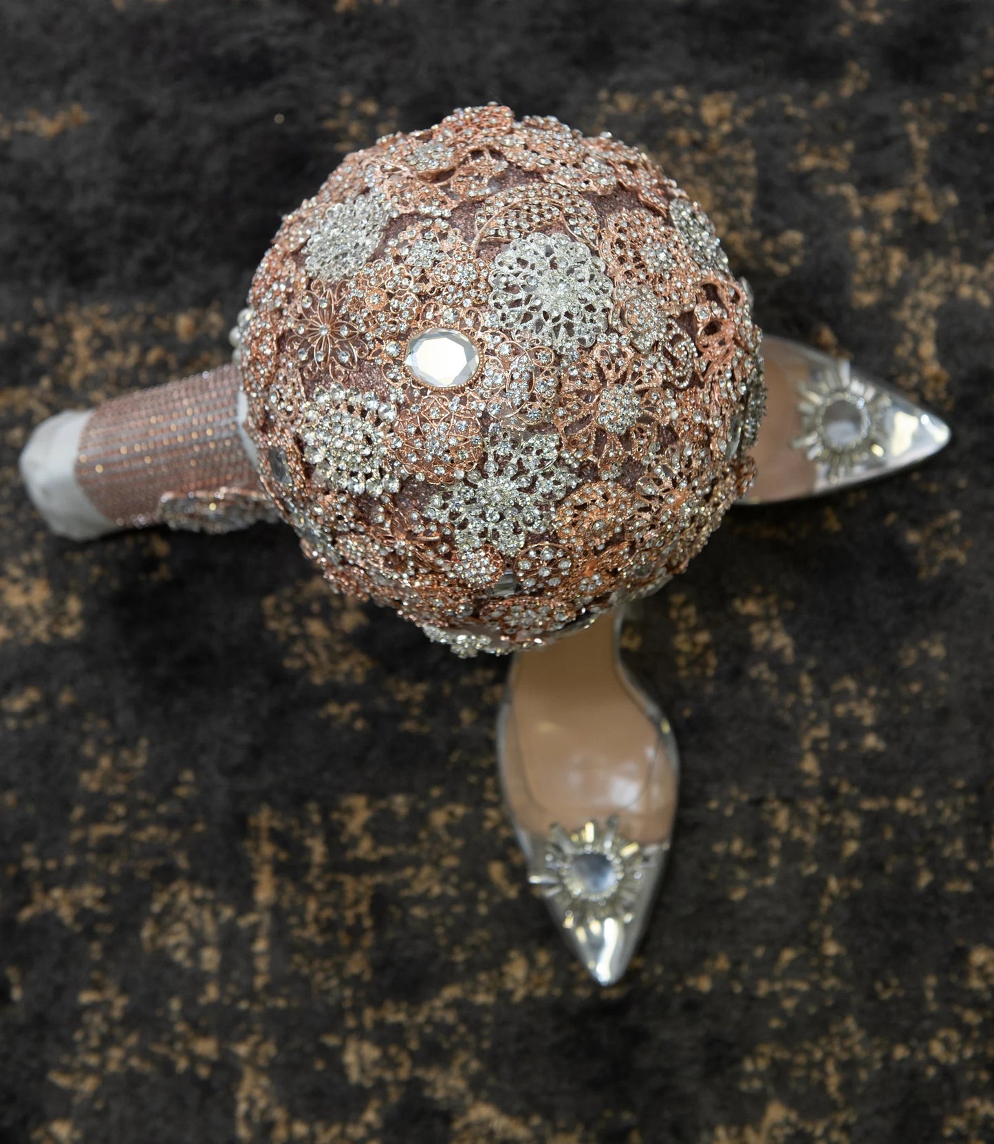 10inch Rosegold Brooch Bouquet, Blinged Bouquet, Handmade. This alluring rosegold brooch bouquet combines a variety of dazzling, crystal rhinestones for a one of a kind look. To complete the look, a satin bow was added to this glamorous bouquet and the handle was wrapped in satin. It's perfect for any bride and will be a lasting keepsake on that special day.